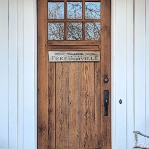 Welcome To Freedomville house plaque