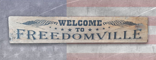 Welcome To Freedomville house plaque.