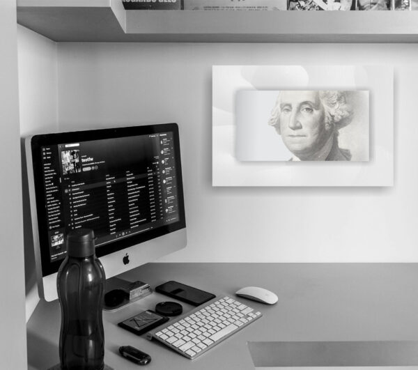 Home office scene with George Washington portrait.